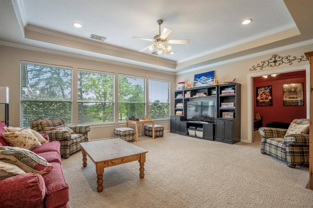The upstairs game room has fantastic views, is huge and could be utilized in many ways to optimize the space and offers an amazing tray ceiling adding to height and space.