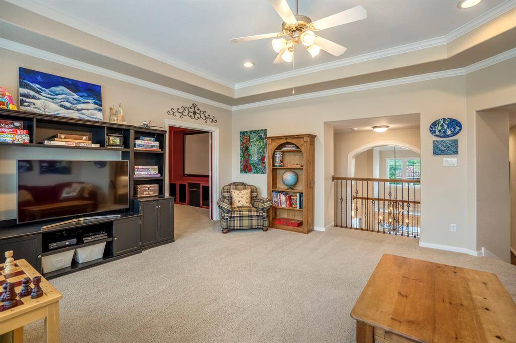 Another view of the gameroom with openings that have special detailing to add to the elevated luxury of the home.