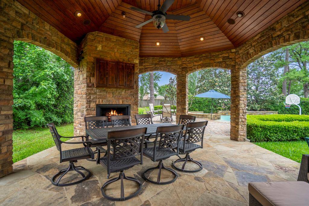 This well-designed outdoor kitchen works together with its indoor counterpart when entertaining guests and compliments the home and landscaping.