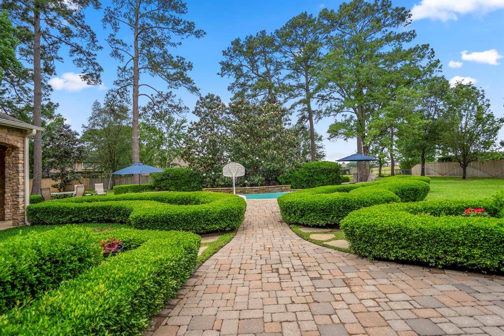 Step outdoors to the amazing manicured gardens, pool with raised spa & golf course views! This home is special.
