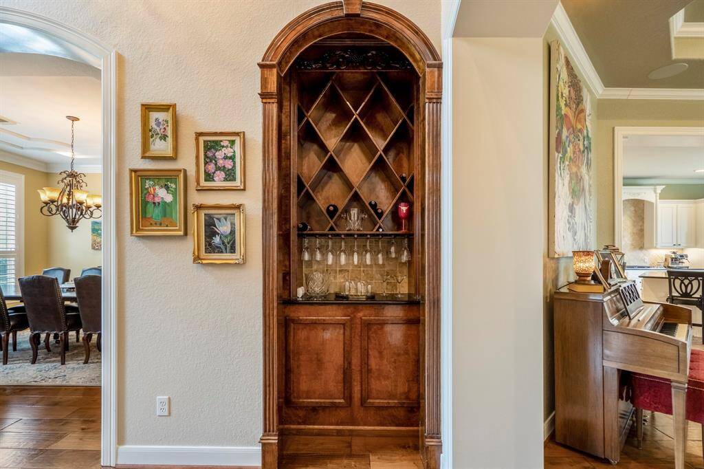 A special featured custom wood wine grotto offers a wet bar area to serve your beverages.