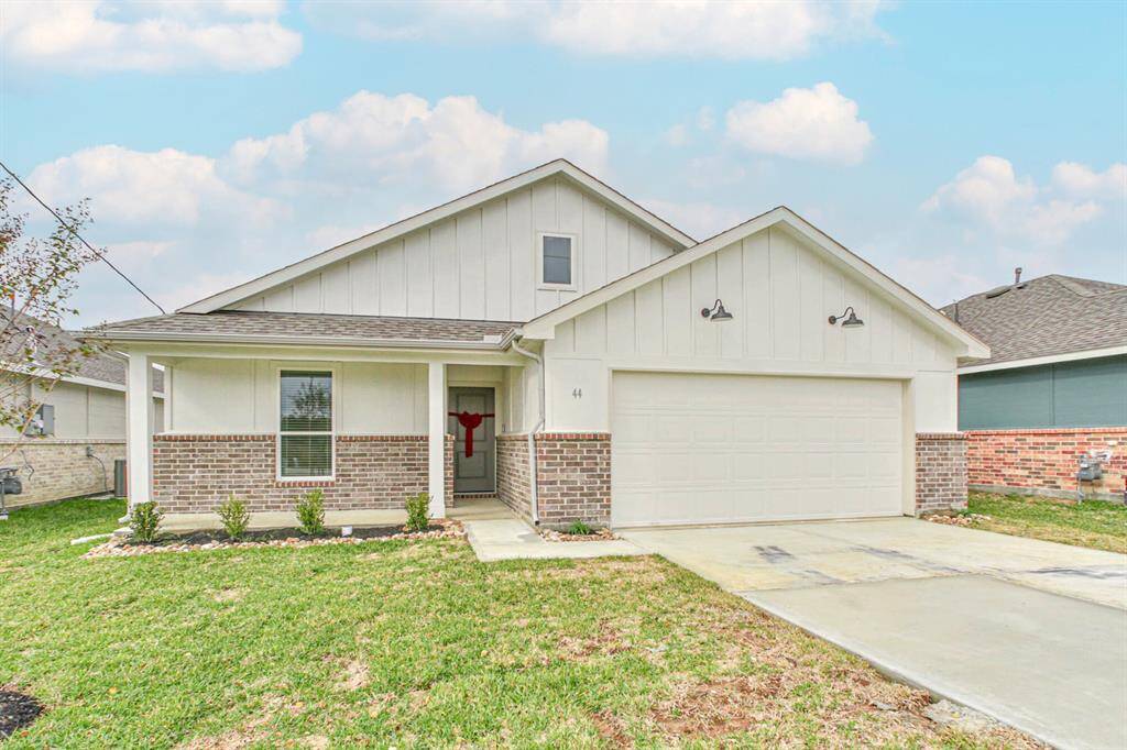 Welcome to 44 Road 5102A in Cleveland, TX! This charming farmhouse-style home captivates with its inviting exterior. The extended front porch creates a warm and welcoming atmosphere, perfect for relaxing evenings or enjoying a cup of coffee in the morning.