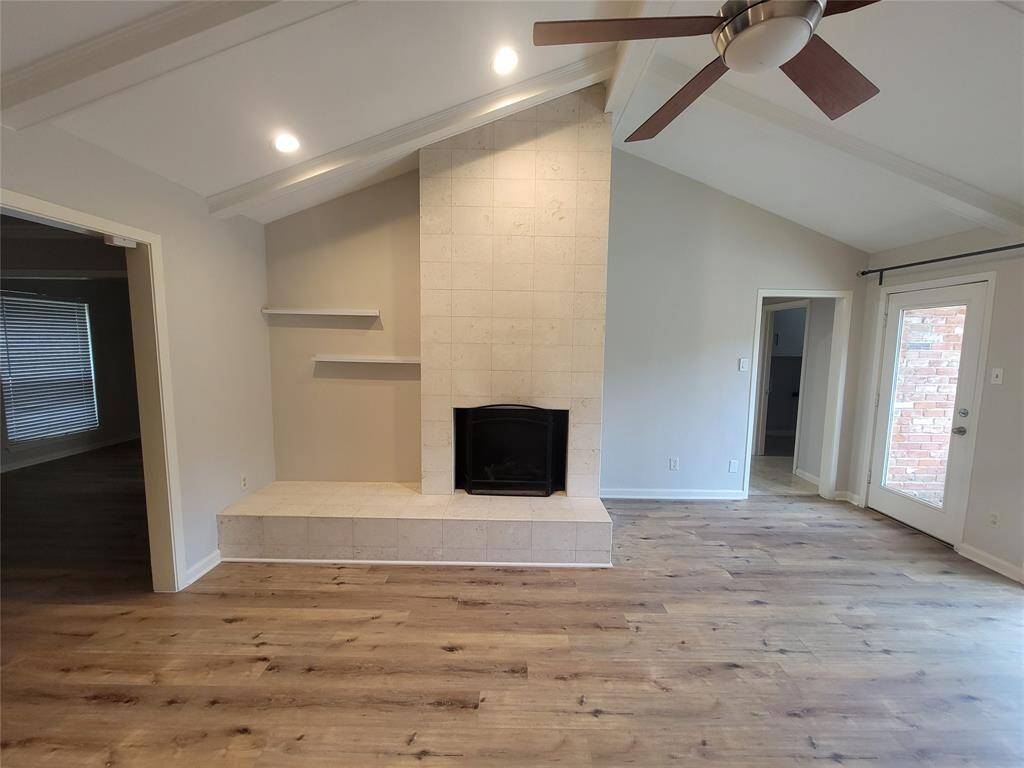 This cozy pitched, planked ceiling brings intimacy to this vast living area.