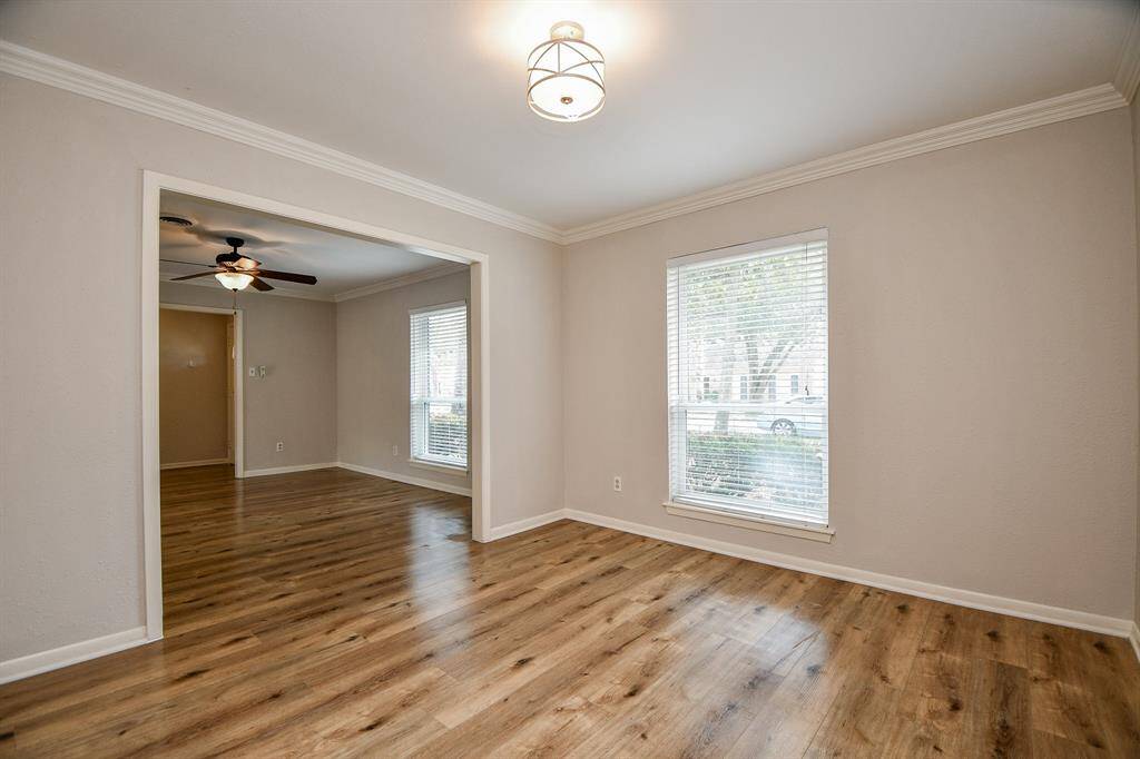 Large, wide windows add to the glow of the shining wood floors!