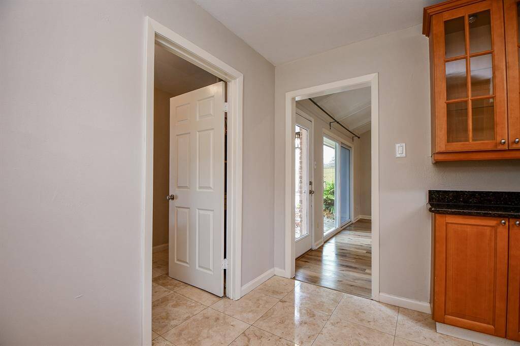 This doorway from the kitchen easily accessesyour welcoming living area!