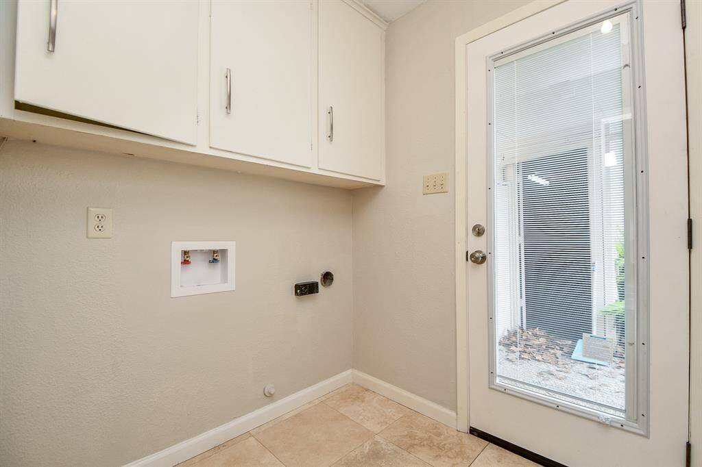 Your neat, roomy utility room (with patio door to outside) is ready with hookups and closet storage above, for dual appliances.