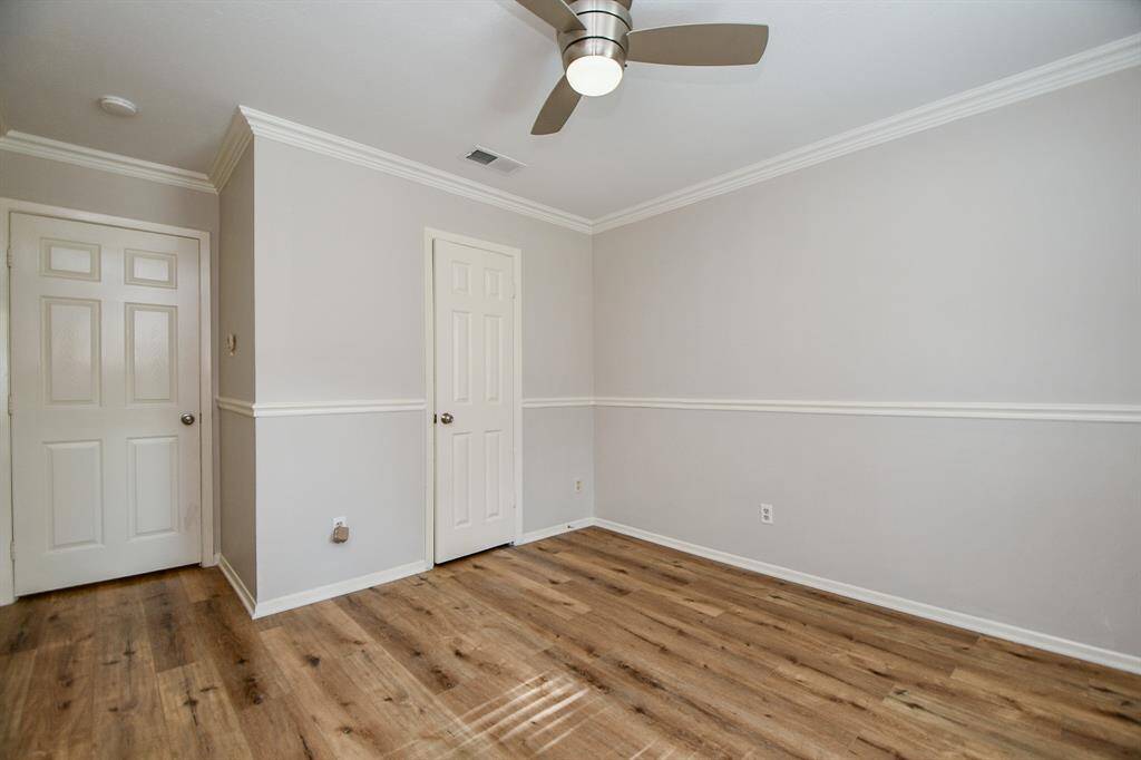 Another roomy bedroom --- with beautiful wall detail --- extends a warm welcome!
