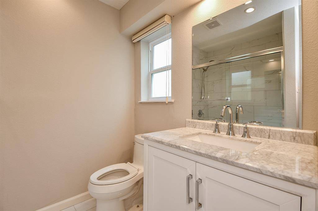 The home's secondary full bath is relaxing and welcoming.