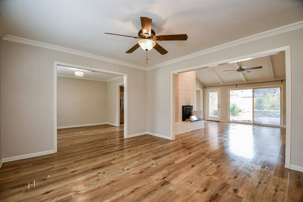 This amazing expanse of wood floored space, complemented by cafe-au-lait colored walls with classic crown molding, frame your furnishing intentions!