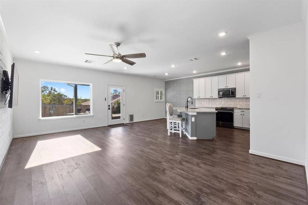 Open living area living dining combo.