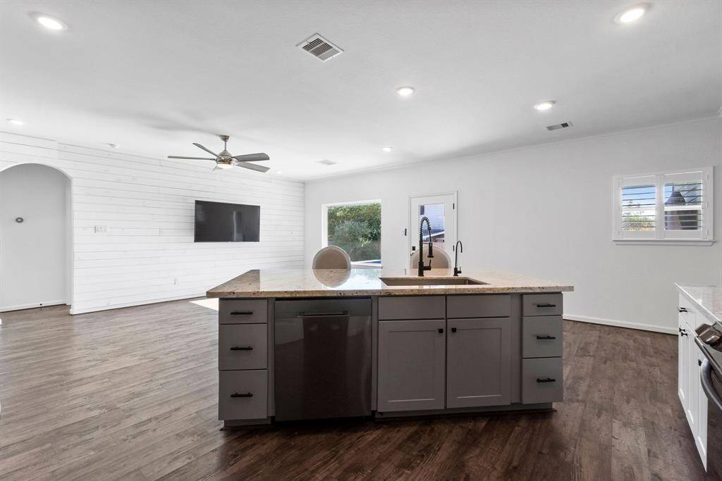 Island looking out to living area open to dining