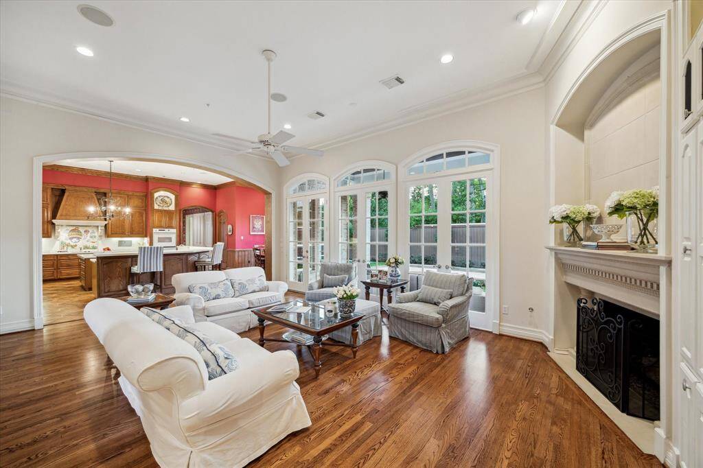 Exceptional view of the family room showcases its seamless connectivity to the kitchen, enhancing the sense of openness and elegance. The space is designed to exude luxury and comfort, making it perfect for both intimate gatherings and grand entertaining.