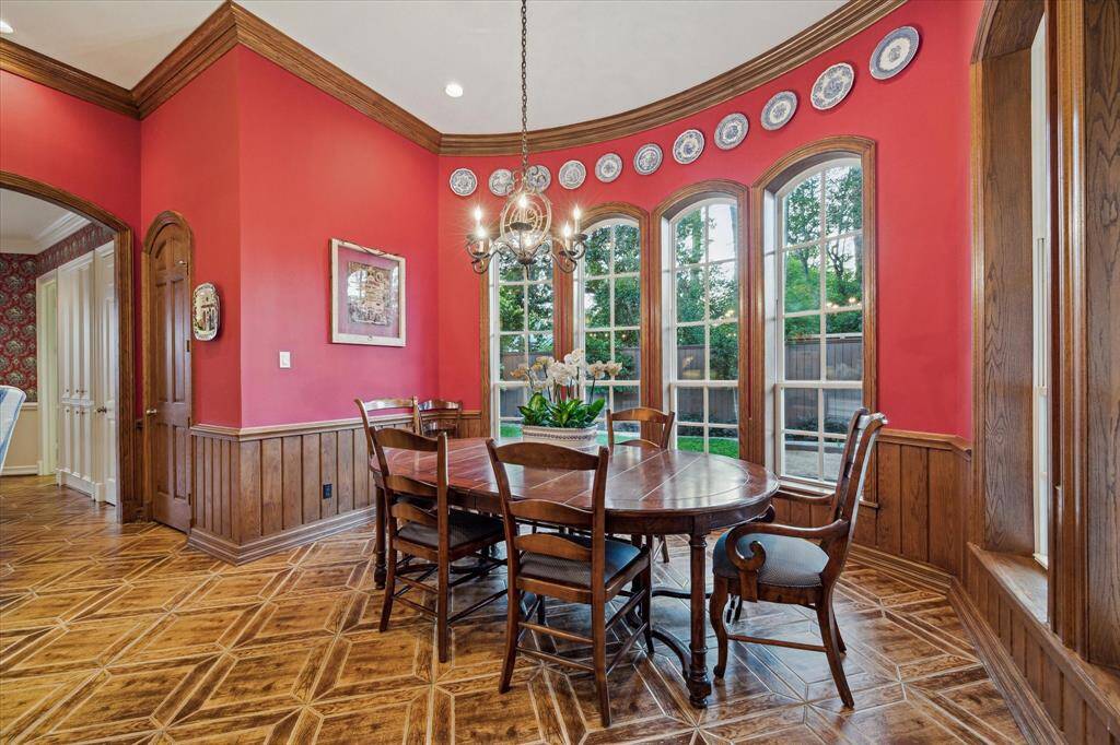 Arched windows in this charming breakfast room offer a view of the beautiful backyard, spacious enough for a table of eight. A locked storage closet provides secure space for your most important items.