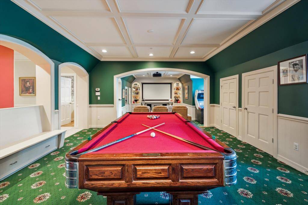 Who wouldn't want to entertain here?! Upstairs, you'll find the welcoming billiard room and media room, perfect for hosting friends and family. Additional storage closets, cozy built-in seating, and niches for fun games add to the charm. Plus, Foosball and Golden Tee can be purchased if desired, making it even more enjoyable and comfortable.