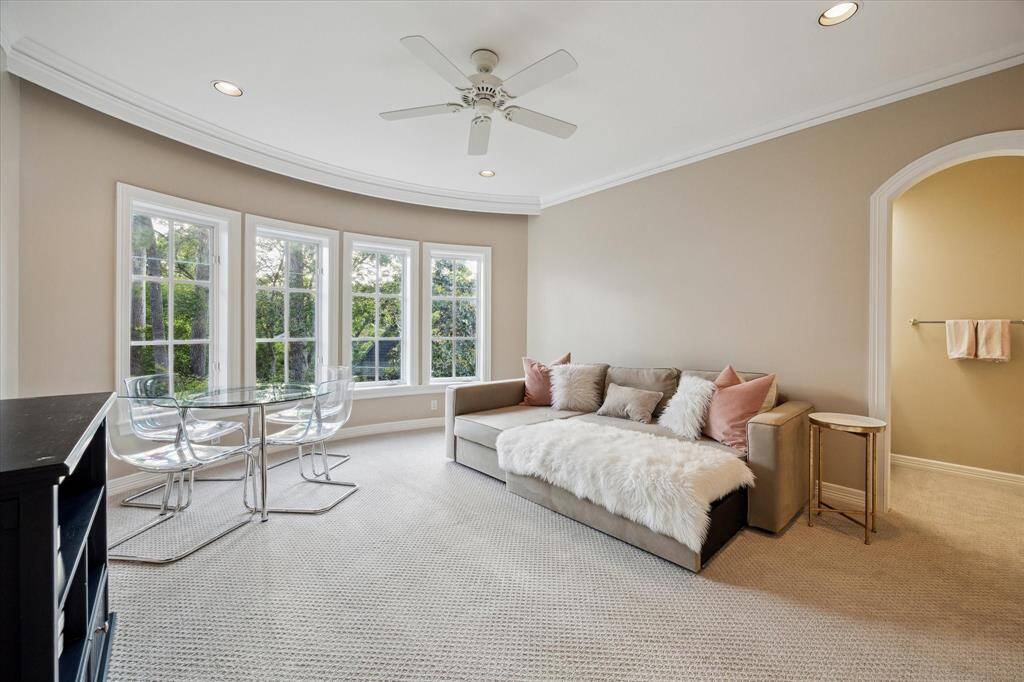 Charming steps from the landing lead you to two bedrooms that share a bathroom. Both of these bedrooms offer picturesque views of the backyard.
