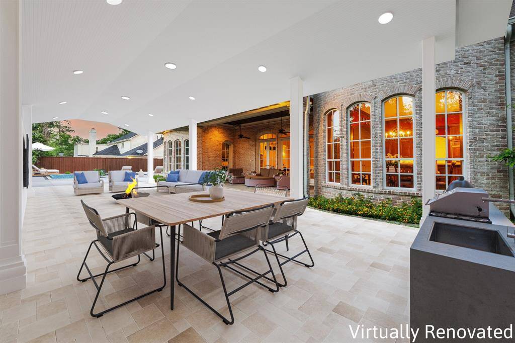 *Virtually Renovated* Outdoor Area Illustrating the Potential for a Patio, Outdoor Kitchen, and Pool Installation