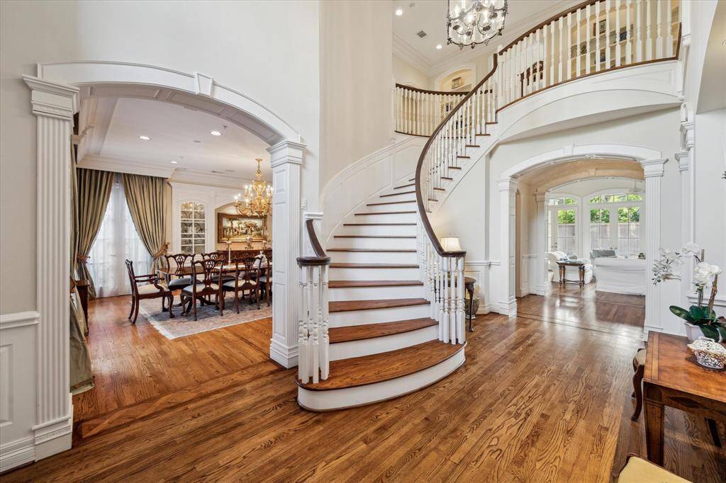 As you enter the home, you are greeted by soaring ceilings in the entryway. Recently refinished hardwood floors flow seamlessly into each room, with meticulous attention to detail in the transitions.  All millwork is custom to the home and was crafted on site.