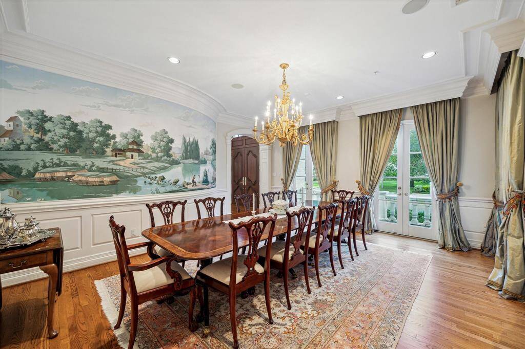 Another exquisite view showcases the intricate French wallpaper, leading gracefully to the front entry. The wallpaper's delicate patterns and rich colors create a stunning visual journey, enhancing the elegance of the space.