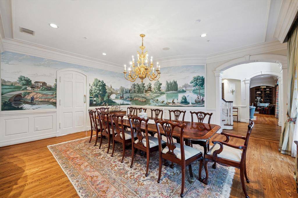 The door opens to the butler's pantry and gourmet kitchen allowing serving with ease. With seating for at least twelve, there is ample space to host your most discerning guests.