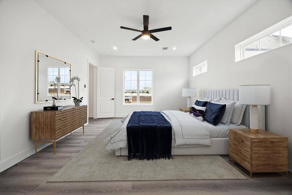 Another view of primary bedroom, virtually staged