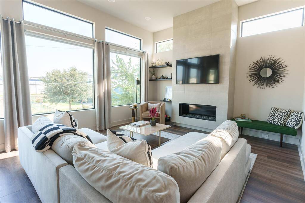 Now come relax in the living room with an abundance of natural light or pull down the custom widow shades and enjoy a movie