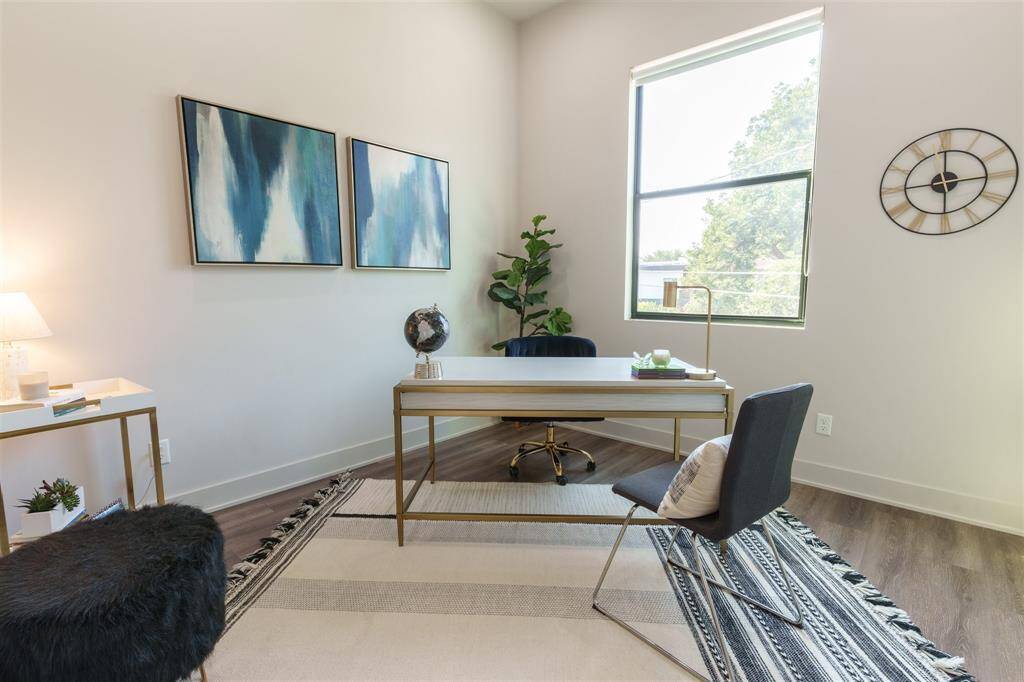 Just off living area is first bedroom being used as home office