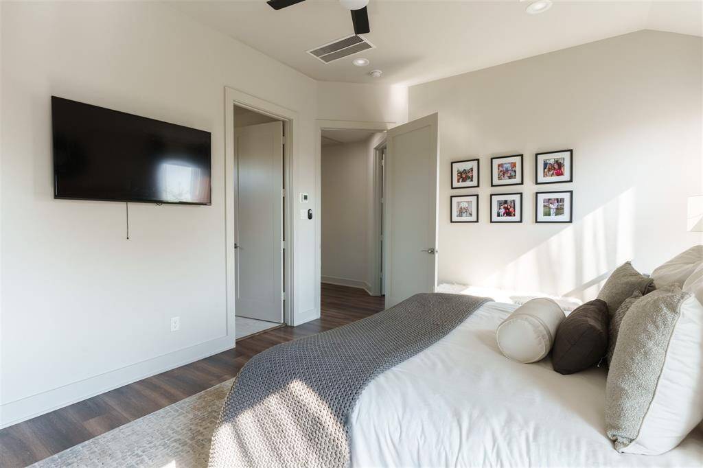 Spacious primary room provides an atmosphere of relaxation complete with blackout shades.
