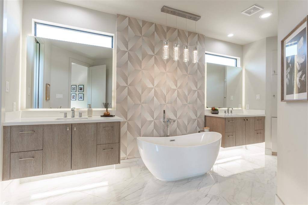 Designer Touches with Double Floating Vanities, soaking tub with custom chandelier