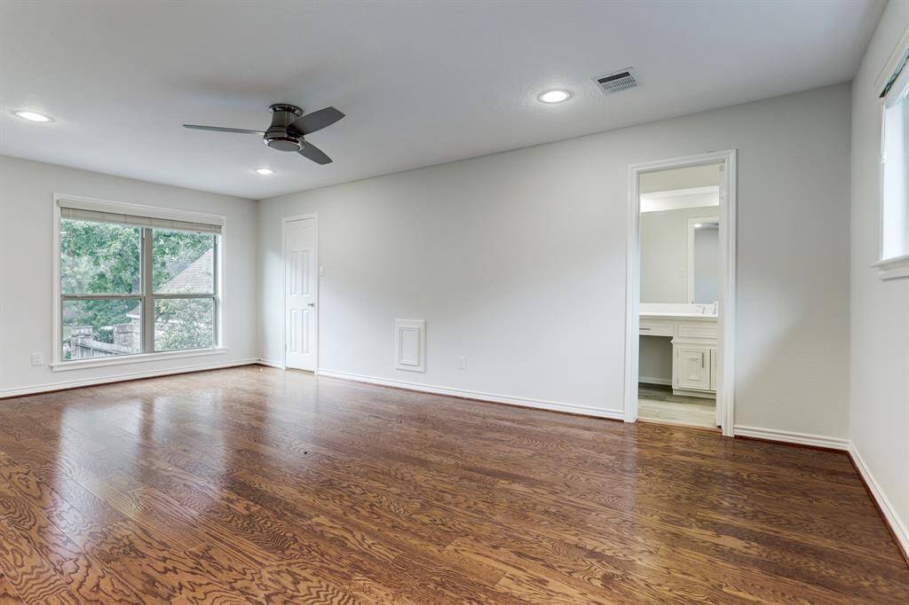 One of three second floor guest bedrooms. The bedroom features a private en suite and walk-in closet.