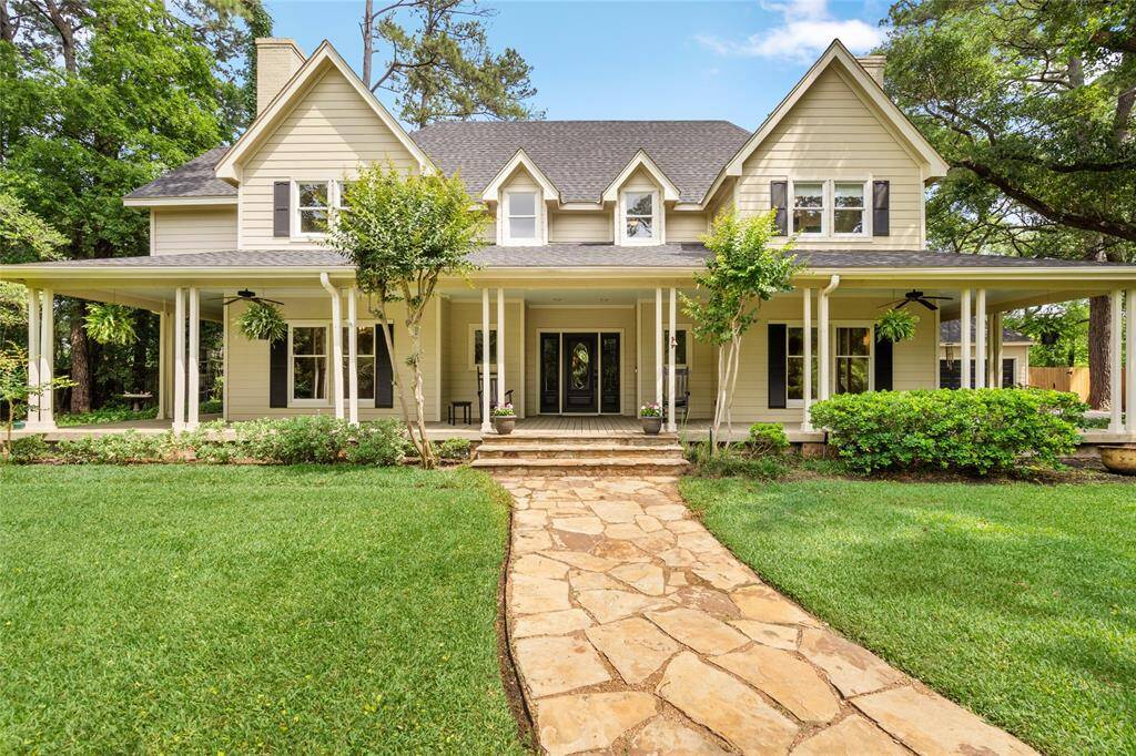 Impressive curb appeal meets timeless charm—this stunning custom home sits on 1.125 acres in a gated community, surrounded by mature trees and featuring a circle driveway, wraparound porch, and oversized three-car garage, guest house, resort-style pool and two level cabana. A true showstopper from the moment you arrive.