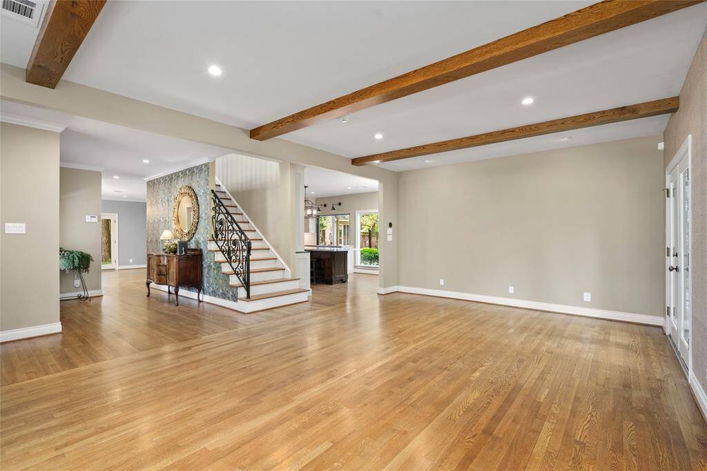 Expansive living room with natural light, open-concept flow, and easy access to the kitchen and dining areas—ideal for relaxing or hosting gatherings.