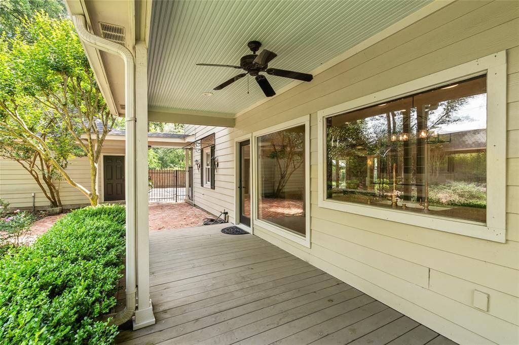 A spacious back porch, ideal for grilling and enjoying the outdoors. This relaxing spot offers easy access to the backyard and is perfect for unwinding or entertaining.