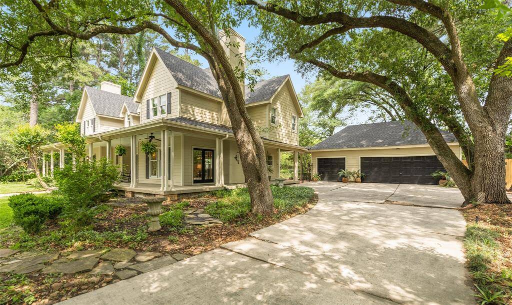 Private drive leading up to three-car garage with built-in storage, combining functionality with style.