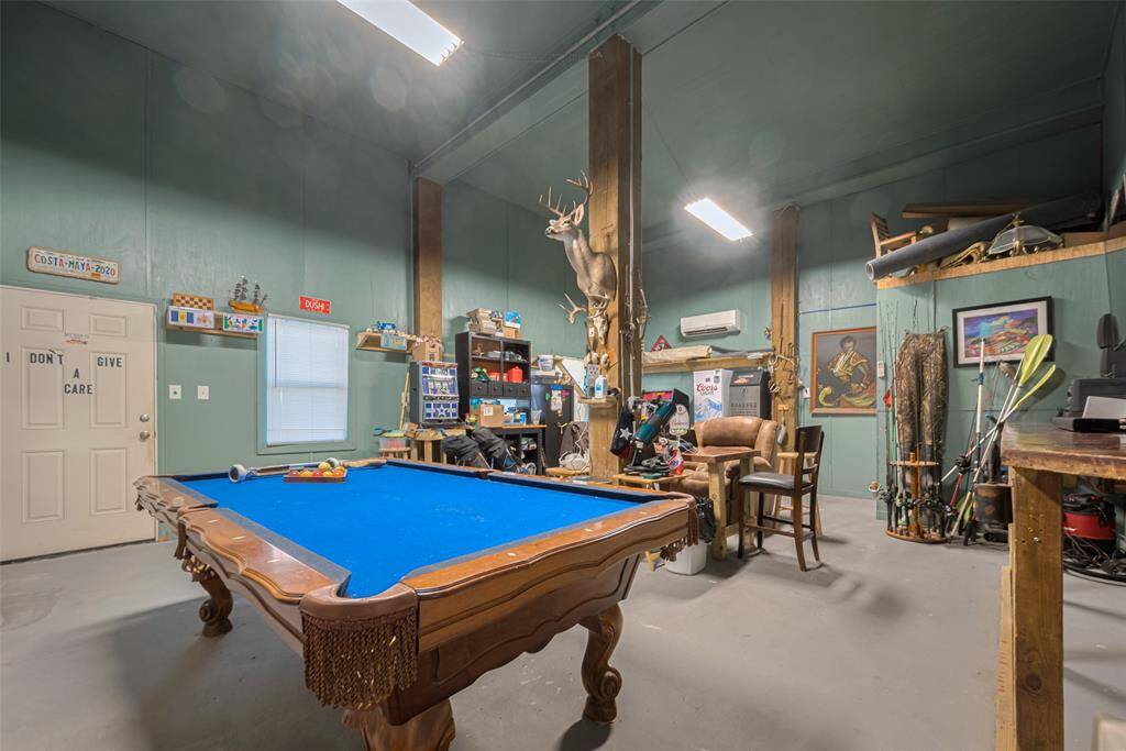 Bonus room on the ground floor with half bath. Man cave, workshop, game room. The possibilities are endless. Has access from either the canal side or the back side.
