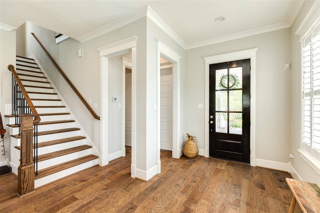 Entrance to home with primary bedroom located near front entrance.