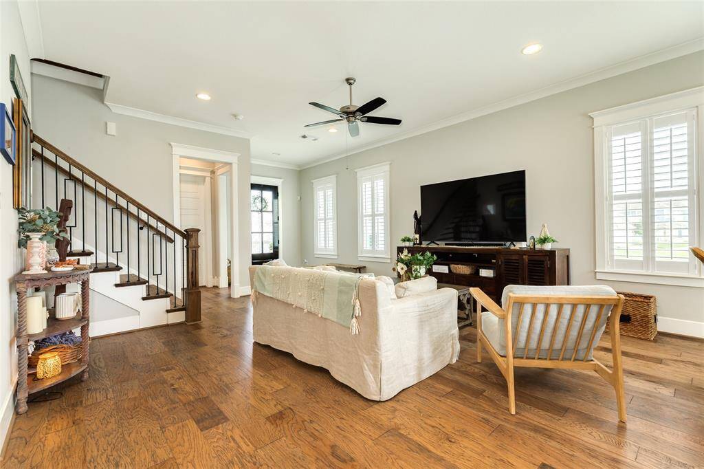 Living space and stairs leading to upper level.
