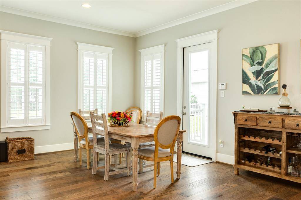 Dining space and door to back area of home.