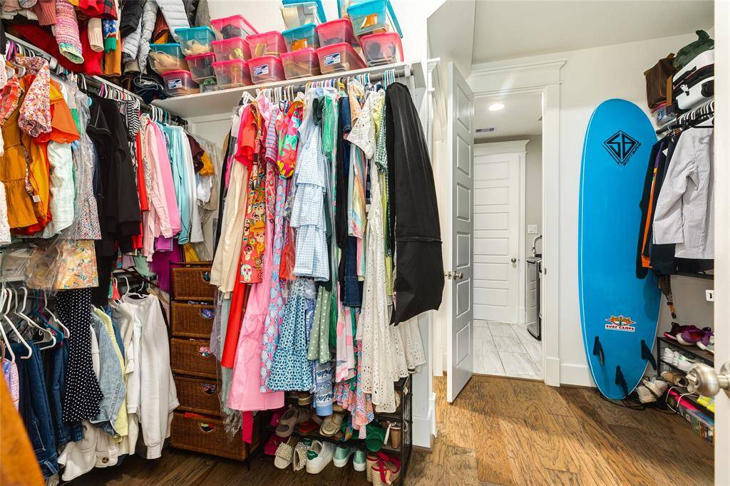 Large walk in closet that also has access to laundry room.