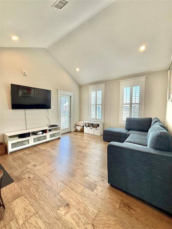 Upper level family room that is great for gatherings.  Exterior door to upper deck/balcony.