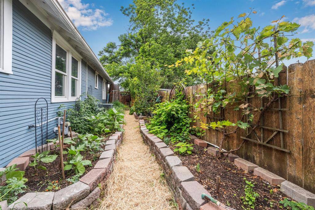 Running along the south side of the home, an established raised-bed organic vegetable garden offers both visual appeal and the joy of harvesting your own fresh, homegrown produce.