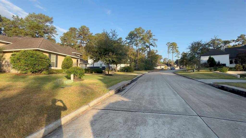 Street view in prestigious section 40.  Lot faces to the East, secluded in shade on the rear patio.