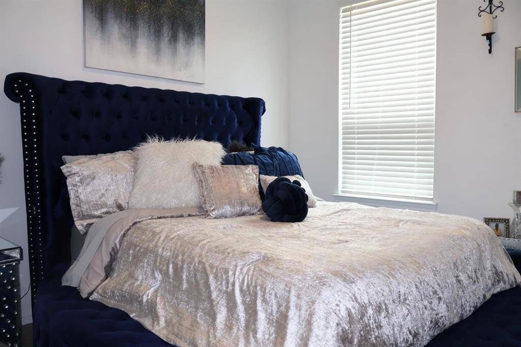 Discover comfort and flexibility in this home's two generously sized secondary bedrooms. Offering ample space for relaxation, work, or play, these versatile rooms adapt to your every need.