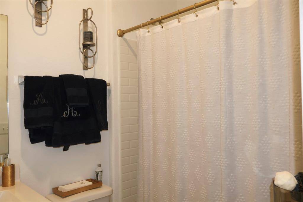 Secondary bathroom offers a large vanity and tub/shower combo!