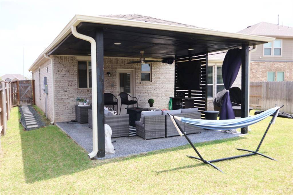 Covered patio is perfect for outdoor furniture and grill!
