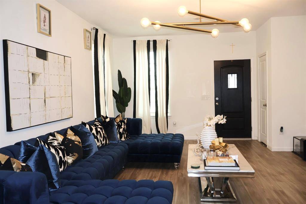 Step into a world of seamless living in this beautiful open-concept home. The expansive living area, modern kitchen, and inviting dining space flow effortlessly together, creating the perfect environment for relaxation and entertaining.