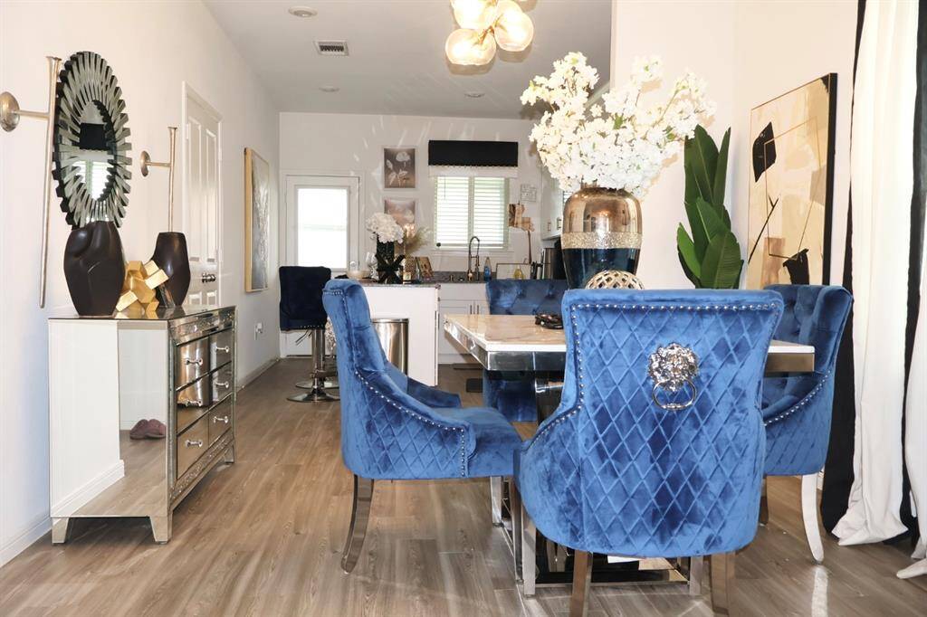 The dining space, conveniently located adjacent to the kitchen and living room, boasts two large windows that flood the area with natural light. Perfect for casual meals or formal entertaining!