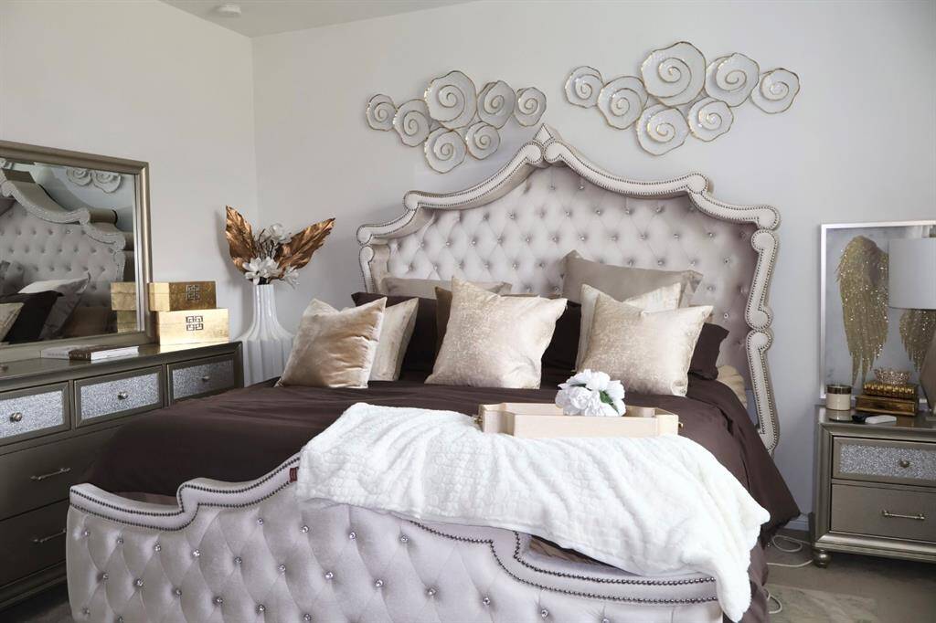 Escape to your personal sanctuary! This stunning primary retreat boasts plush carpeting, serene white walls, and a luxurious ensuite bathroom. The expansive walk-in closet offers ample space for your entire wardrobe, ensuring a clutter-free and relaxing environment.