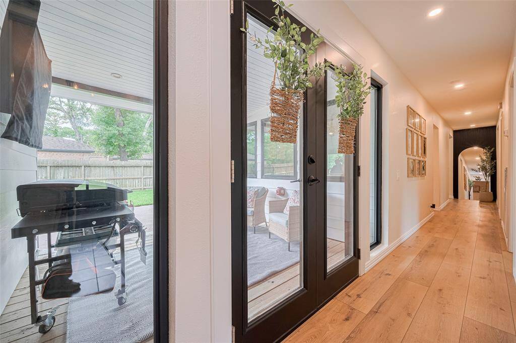 The hallway offers a great view of the backyard patio.  Did I mention the amount of natural light in this home?