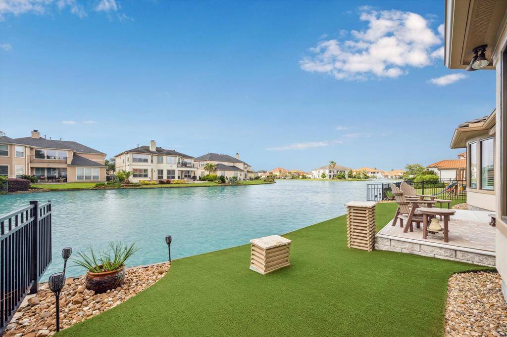 Welcome to 13607 Morgan Creek – a resort-style waterfront retreat nestled in the exclusive Lakes of Parkway community. This exceptional home offers serene water views, luxury finishes, and the tranquility of lakeside living.