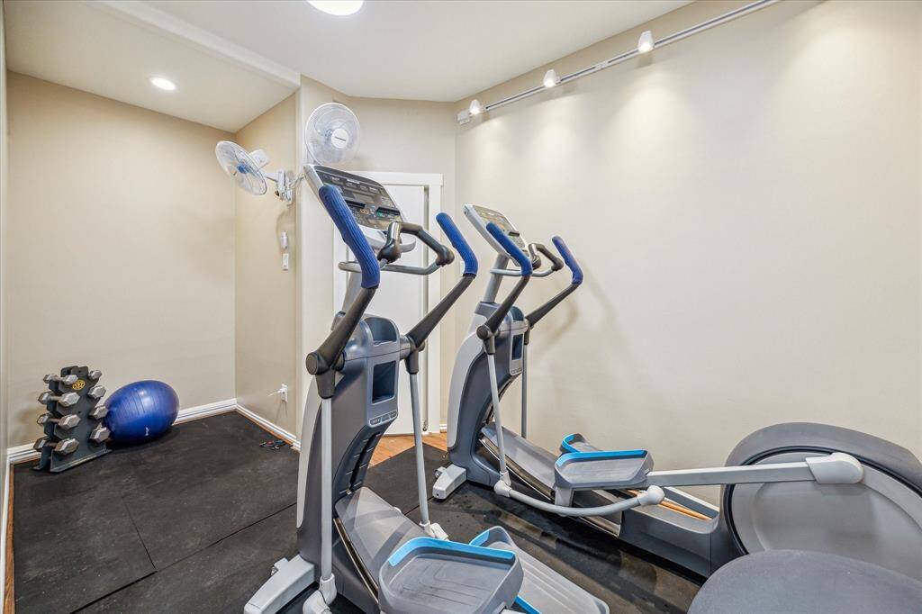 The flex room features recessed lighting and offers versatile potential—ideal for use as a home gym, playroom, extra storage space, or whatever suits your lifestyle.